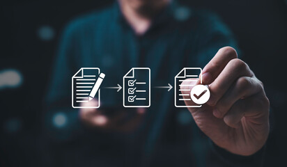 Businessman using electronic pen sign tick mark on virtual document for online approve paperless quality assurance and ERP management , Prepare check and approve document concept.