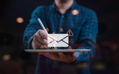 Businessman using tablet, surrounded by warning icons symbolizing email alerts. The scene conveys urgency and a focus on digital communication, highlighting the importance of email security.