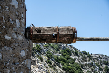 ancient Greek mills against a Mediterranean landscape on the island of Crete