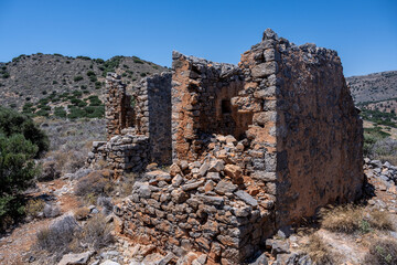 ancient Greek mills against a Mediterranean landscape on the island of Crete