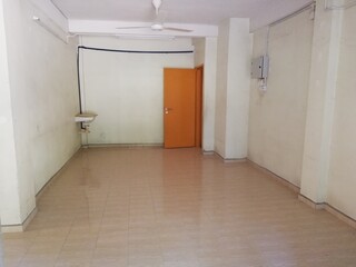 Apartment renovation interior showing wall repainting, lighting setup, furniture arrangement, and bathroom upgrade in clean modern living space