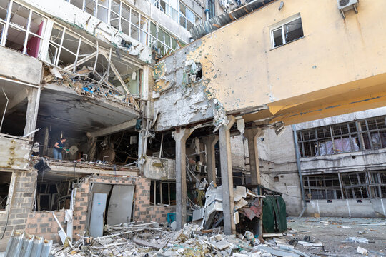 Damaged buildings after air strike reveal destruction and despair - Powered by Adobe