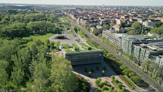 Still drone video from an aerial viewpoint showing the Museum of Ethnography, City Park, and Pusk&aacute;s Ar&eacute;na in Budapest during morning light with no camera movement.  