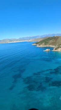 Powered paragliding paramotor flying over Albanian coast mountains and beaches aerial panorama landscape view,Albania,Balcan