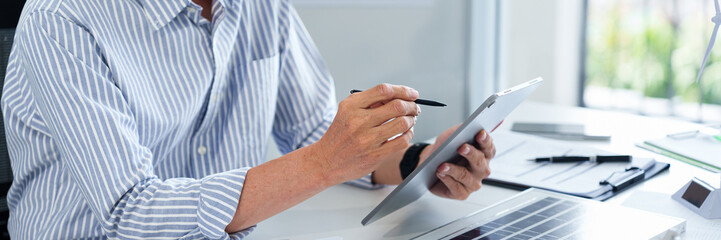 Sustainable Business Strategy Asian Adult Hand Using Digital Tablet with Solar Panel Model ESG Innovation