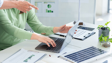 ESG Business Strategy Meeting Analyzing Sustainability Data and Renewable Energy Solutions with...