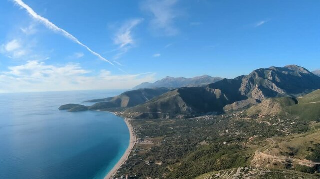 Powered paragliding paramotor flying over Albanian coast mountains and beaches aerial panorama landscape view,Albania,Balcan