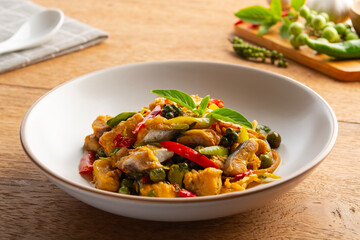 Thai Spicy stir fried Siriped catfish with chilli green peppercorn Fingerroot and kaffir lime leaves.(Pla Sawai Pad Cha)