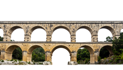 Ancient stone aqueduct with multiple arches over rocky terrain and green foliage