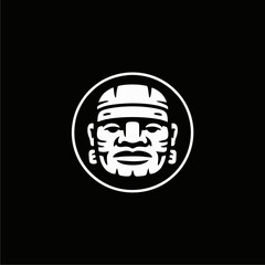 Illustration of a stylized Olmec head inside a circle, depicted in white against a black background.