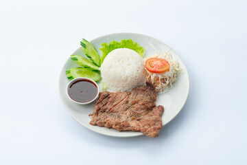 Roast Pork and Rice On a white plate