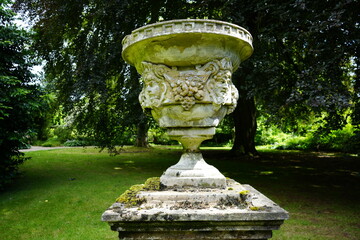 Newby Hall and Gardens, North Yorkshire, England – July 15 2023: Ornate stone garden urn with...