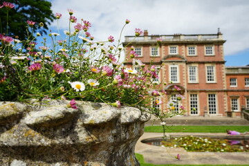 Newby Hall and Gardens, North Yorkshire, England – July 15 2023: Stone flower urn with...