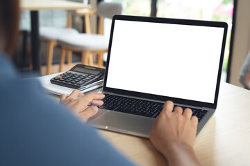 Mockup, woman working on laptop computer with blank white desktop screen on table at home office, mockup, tempale for social media marketing, advertisement or web design