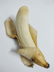 peeled banana on white background