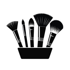 Set of five black makeup brushes in a holder on a white background