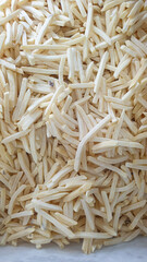 A Close-Up View of Uncooked Frozen French Fries Ready to be Cooked and Served