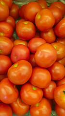 Freshly Harvested Tomatoes Displayed in Bulk at a Local Farmers Market Stall