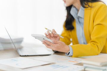 Financial Calculations: An accountant meticulously uses a calculator, immersed in the detailed...