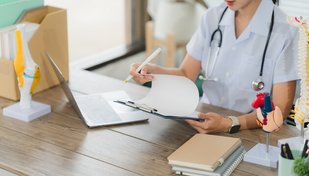Health Professional's Office: A dedicated medical expert meticulously examines patient records within a modern, well-lit practice, providing exceptional medical care.