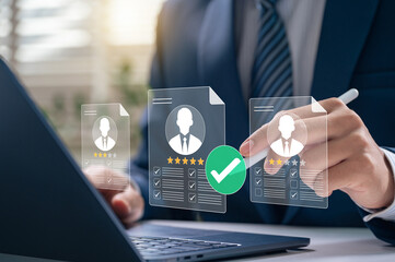 HR professional reviewing candidate resumes with rating and checklist system for recruitment,...