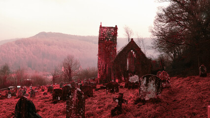 A halloween horror concept of a spooky ruined church and graveyard in the countryside, with a red, infrared like vaporwave edit