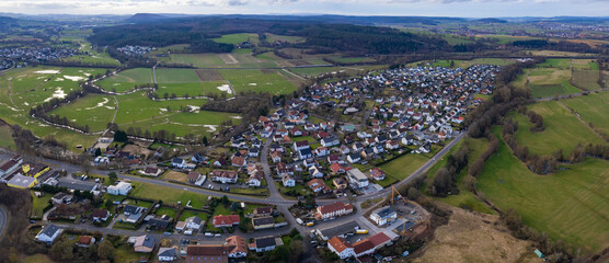 Aerial view of the downtown around the city Löschenrod in Hessen, Germany on a cloudy day. in autumn	
