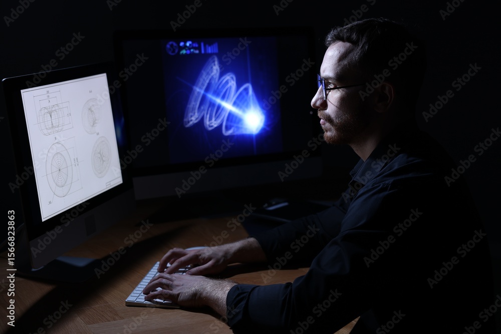 Poster engineer working with digital drawing at table in office