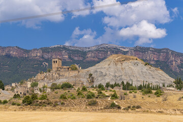 Ruins of Sigues rising above dry fields in Aragon, Spain