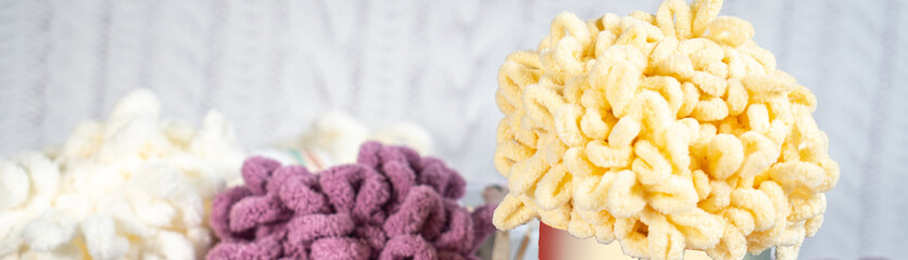Fluffy yarn. Colored threads in reels. Knitting hobby embroidery