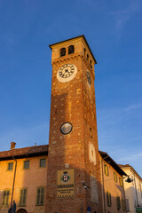 Clock tower standing tall in Cherasco, Piedmont, Italy