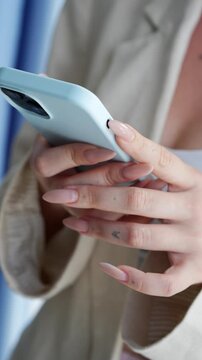 A representative and business girl with a phone in her hands communicates about work with colleagues.
A woman boss with a phone in her hands negotiates with partners online.
Online chatting