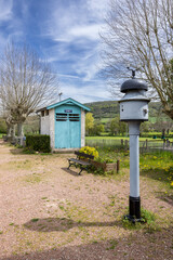 Old water pump and restrooms showing the history of Bligny sur Ouche train station in France