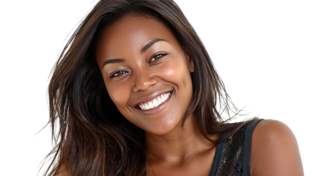 Radiant Smile: A close-up portrait of a young Black woman with a radiant smile, showcasing her natural beauty and healthy teeth.  Her long, dark hair flows effortlessly around her shoulders.