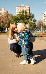 A woman is holding a baby