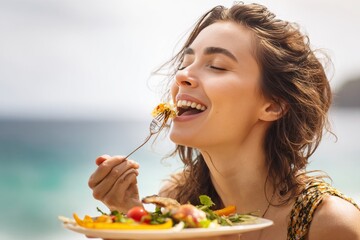 Beautiful young woman delightedly enjoying a vibrant, healthy meal outdoors, eyes closed in pure bliss, celebrating wellness and mindful eating in a scenic natural setting.