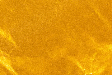 High-resolution gold foil surface with reflective shimmer and subtle wrinkles, ideal for luxury...