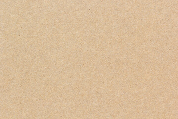High-resolution brown recycled paper surface showing natural fiber texture, perfect for eco-friendly backgrounds, packaging, or craft design projects.