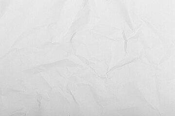 Wrinkled white paper surface with natural creases and soft shadows, ideal for backgrounds, mockups,...