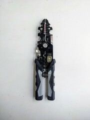 Professional wire stripper and cutter tool in a closed position, isolated on a white background. Electrician or handyman equipment.