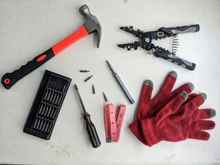 DIY tools and equipment organized in a knolling flat lay on a white background. Workshop, repair...