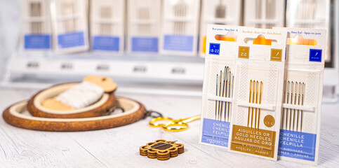 Accessories for hobby. Hoop snaps, threads, needles and scissors. Vintage tools for embroidery and knitting