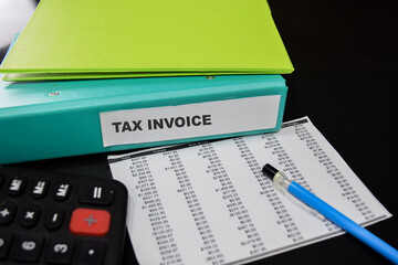 Folders with the label Tax invoice. Business management concept