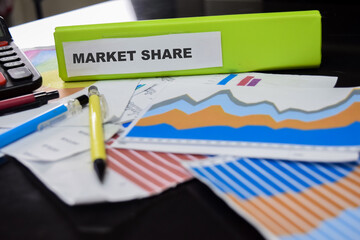 Folders with the label market share. Business management concept