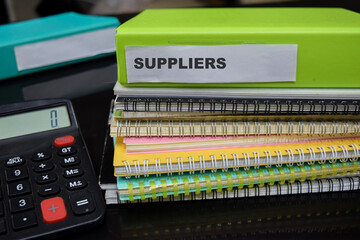 Folders with the label suppliers. Business management concept