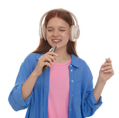 Happy teenage girl in headphones with smartphone singing on white background