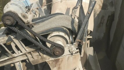 Close-Industrial plant with belt conveyor in open pit mining. Construction site, Industry machine for stone crusher. up shot of the conveyor belt in the concrete plant.