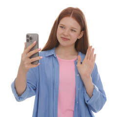 Beautiful teenage girl with smartphone waving hello on white background