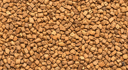 Naklejka premium A dense and uniform arrangement of small brown cork pieces filling the entire frame of the image shot