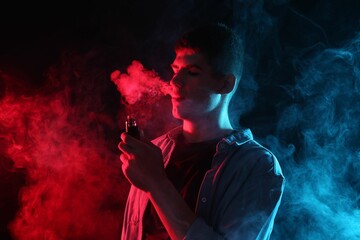 Man using electronic smoking device in neon lights on dark background